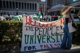 A sign is displayed in front of the pro-Palestinian encampment at Columbia University in New York on April 22, 2024 [Stefan Jeremiah/AP Photo]