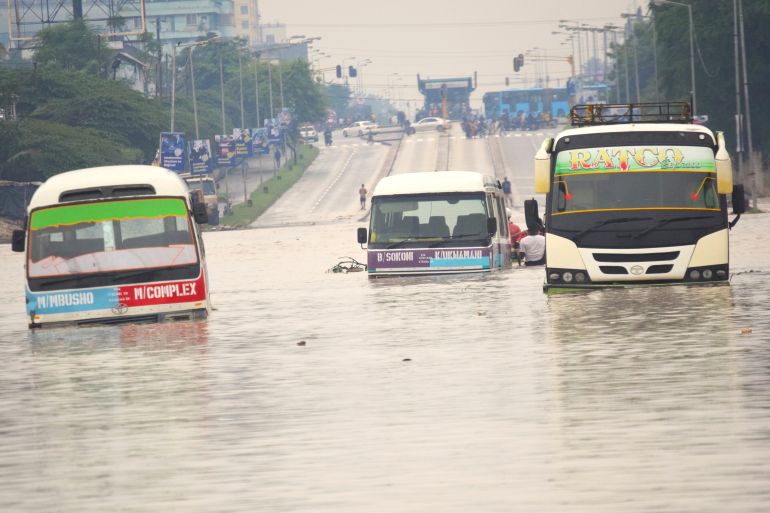 Public minibus are submerged in the flooded streets of Dar salaam, Tanzania