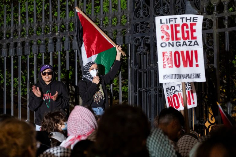 Pro-Palestinian protesters gather near an area where people were being taken into custody near the Columbia University