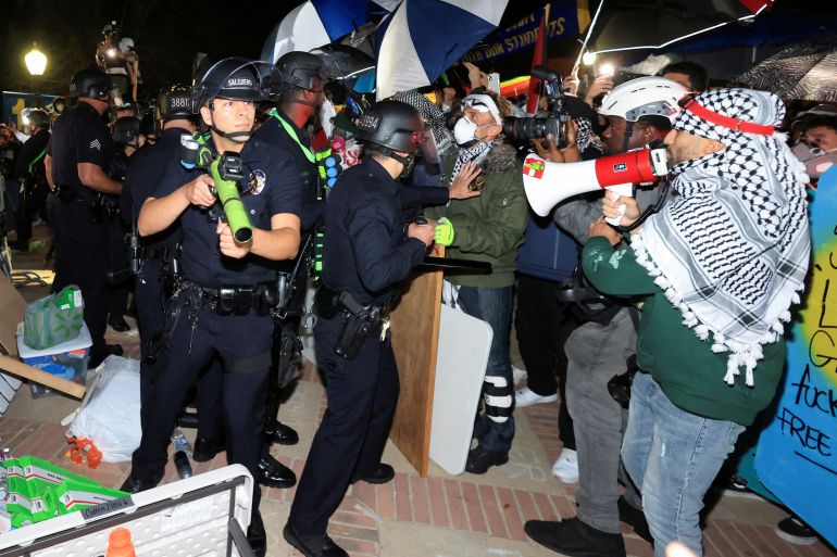 Law enforcement officers enter a pro-Palestinian protest encampment at the University of California Los Angeles (UCLA), as the conflict between Israel and the Palestinian Islamist group Hamas continues, in Los Angeles, California, U.S