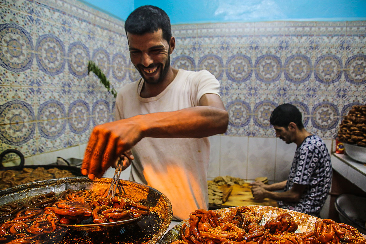 Ramadan would not be complete without traditional hand-made sweets. Prepared fresh in the market of Marrakech, a Moroccan specialty during the holy month is shubakiya, made with sesame, orange blossom and plenty of sugar. [Venetia Menzies/Al Jazeera]
