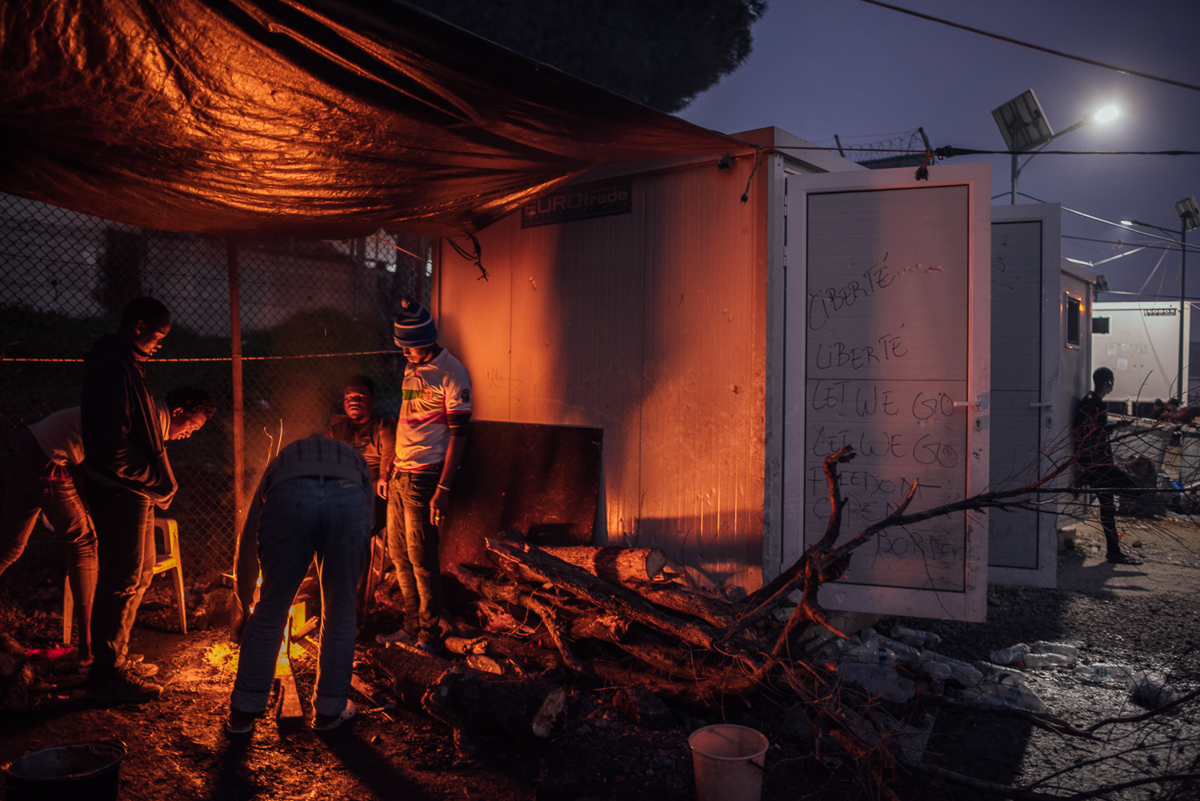 At night, there are many open fires inside the camp. The wood comes from the forest and olive grove surrounding the area, which leads to tensions with the local farmers. [Kevin McElvaney/Al Jazeera]