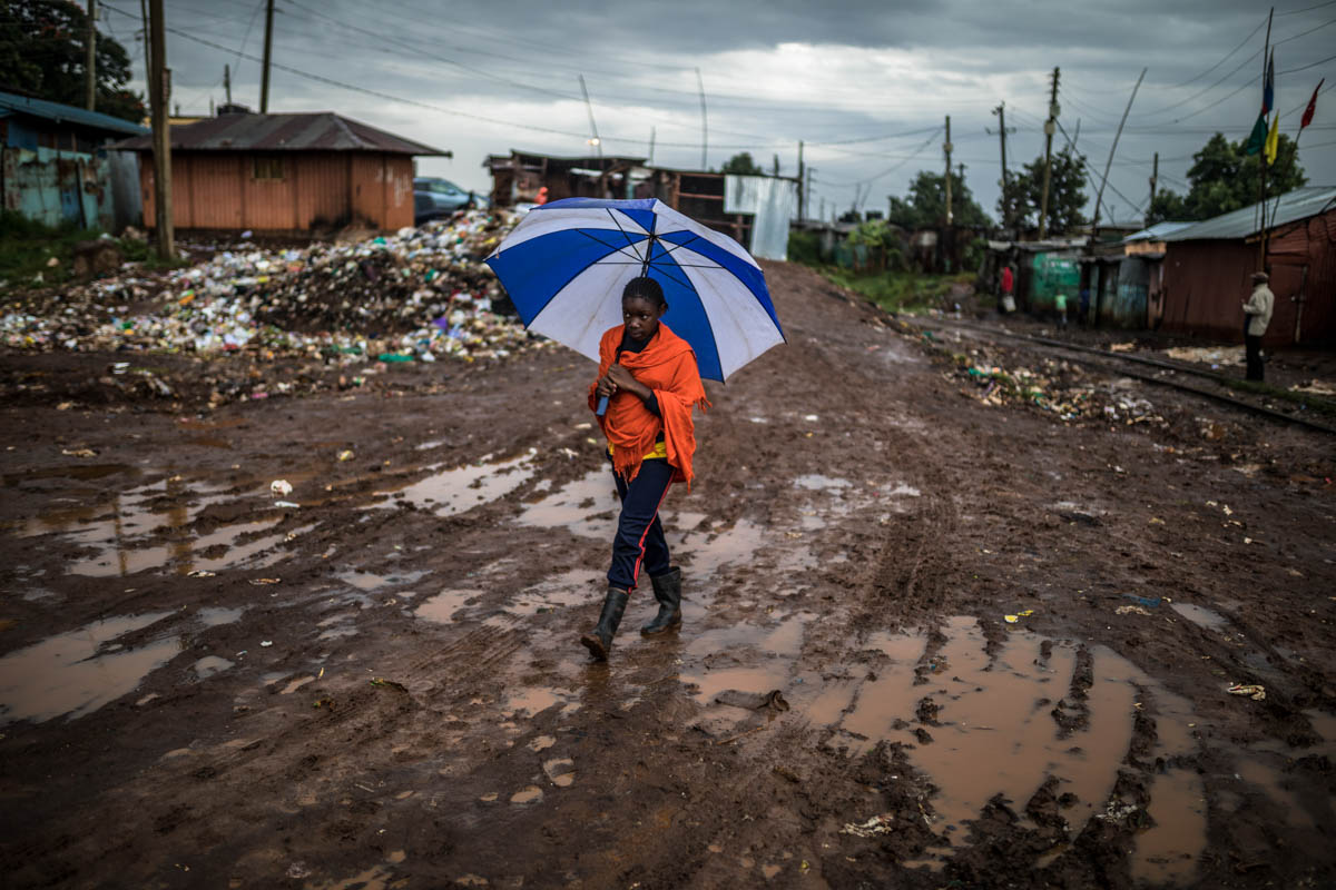 Dirty waters remain stagnant in most streets through the slum during the rainy season, posing a greater risk to the health of the residents. Children are often the most vulnerable to waterborne diseases caused by sewage contamination and environmental deterioration. [Brian Otieno/Al Jazeera]