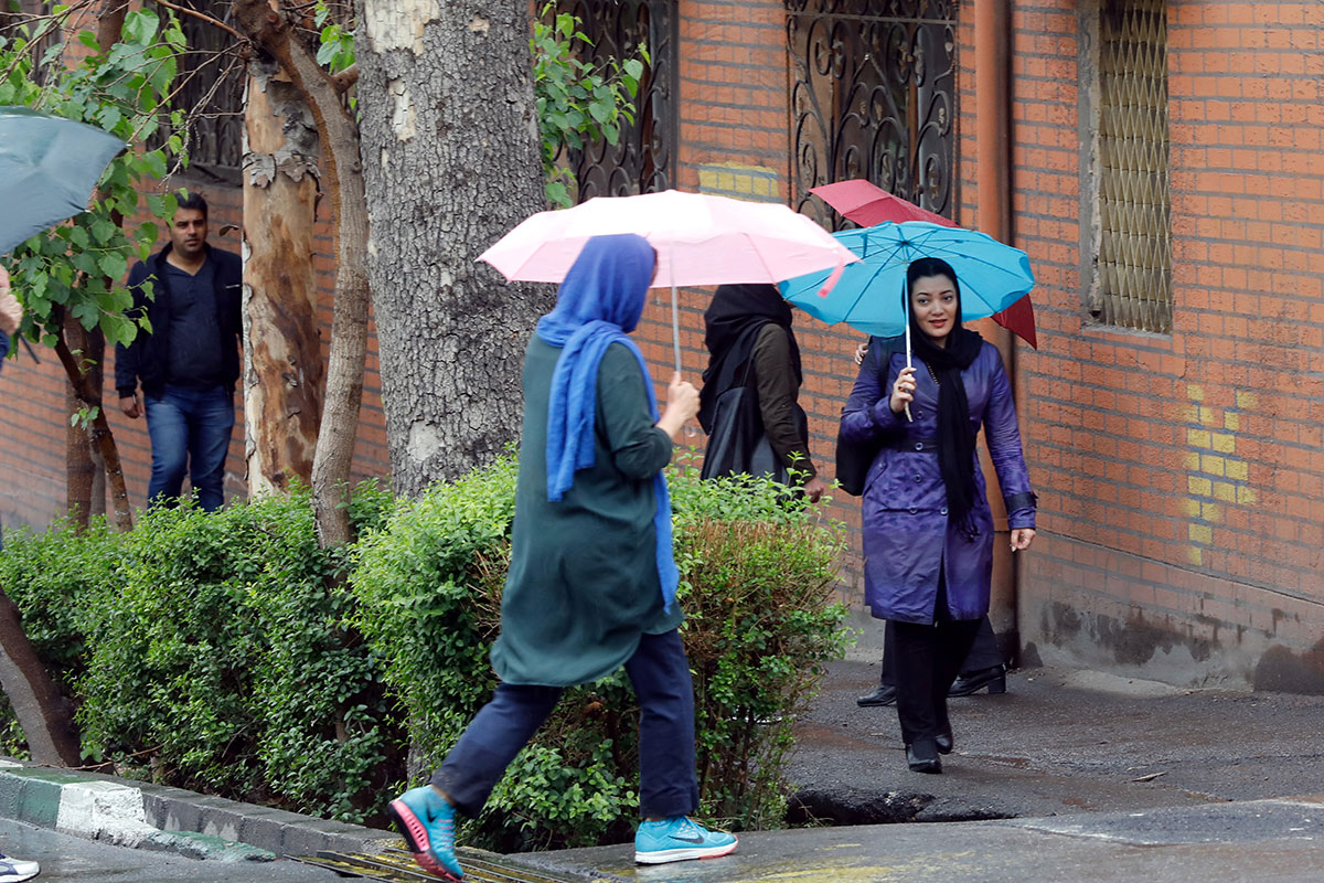 Umbrellas are also up in Tehran, India [Abedin Taherkenareh/EPA-EFE]