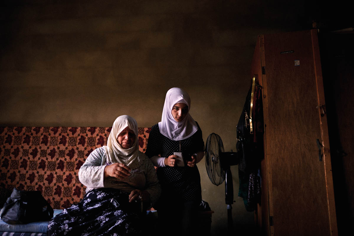 Khalida, 56, relocated to Kherbet Dawood, in northern Lebanon, with her daughters after one of her sons was shot in Syria. Her other son was detained and is still missing. She worries for her daughters' education and her own declining health. 'If the situation improves in Syria, I would like to go back. All my memories and beloved ones are there in Syria, and my mother's grave. To me, there is nowhere more precious than home.' [Diego Ibarra Sanchez/SaferWorld]