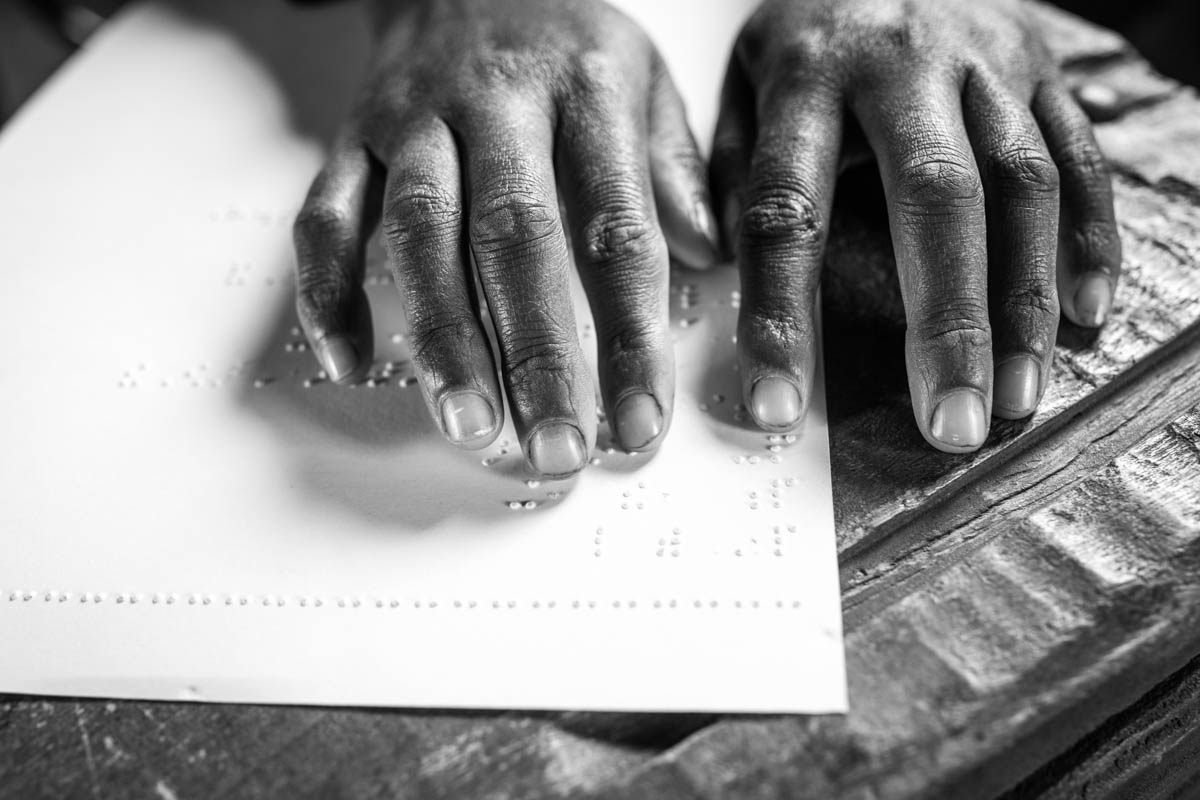 Misaye is determined to learn Braille. "The government needs to support disabled people more," says the quiet girl with determination. "When I have finished my education, I will become a civil servant and change that." [Nathalie Bertrams/Al Jazeera]