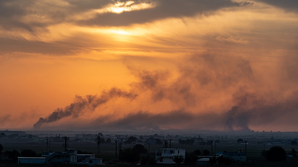 AKCAKALE, TURKEY - OCTOBER 10: Smoke rises over the Syrian town of Tel Abyad, as seen from the Turkish border town of Akcakale on October 09, 2019 in Akcakale, Turkey. The military action is part of a