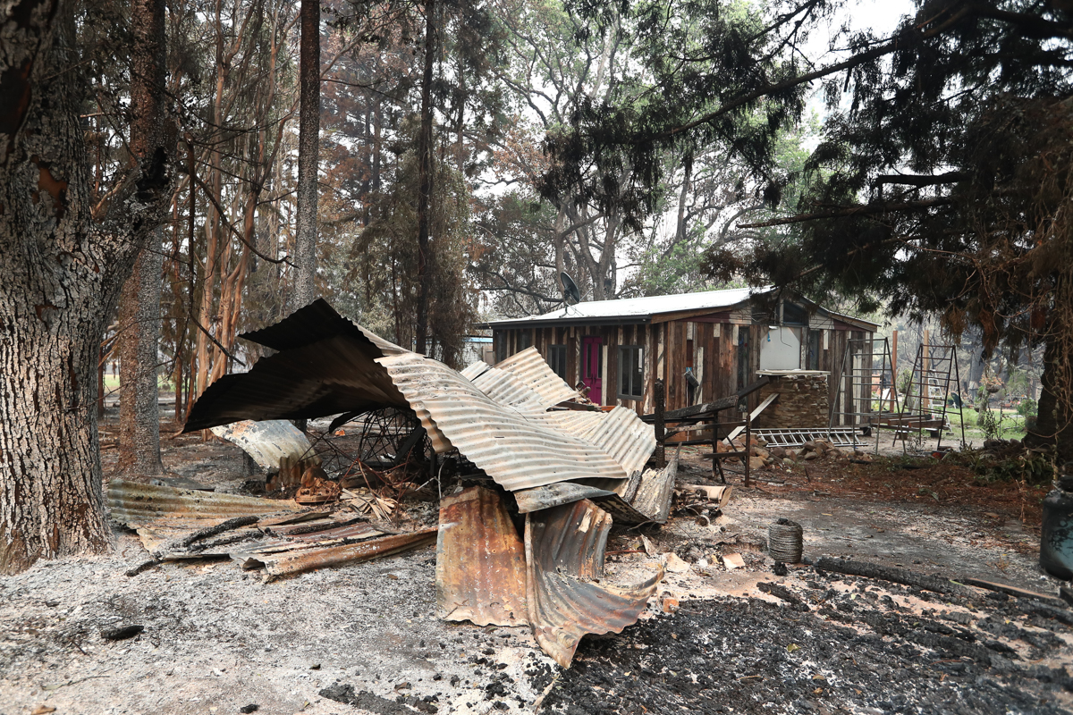 Property devastated by bushfires at Coutts Crossing, New South Wales. [Jason O'Brien/EPA]