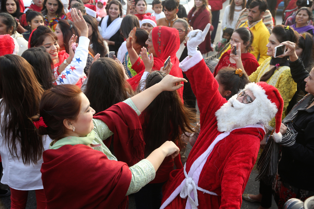 Pakistani Christians mark the Christmas holiday in Lahore, Pakistan. [KM Chaudary/AP Photo]