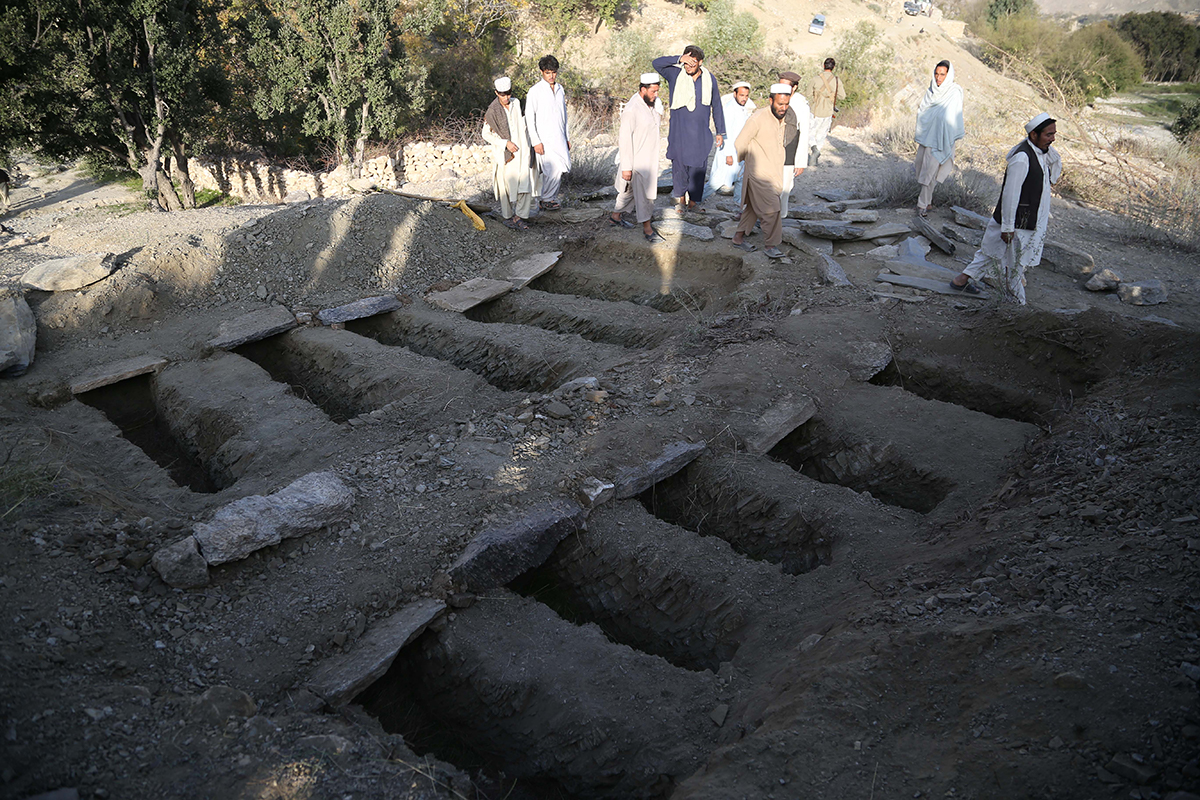 Graves dug to bury the victims of a bomb blast in the Achin district of Nangarhar province, Afghanistan, on October 21, 2018.  According to the UN, there were 3,804 civilian deaths that year, including 927 children, the highest recorded numbers in the country's long-running war that began after US forces led a campaign to overthrow the Taliban in the wake of the September 11, 2001, attacks. [Ghulamullah Habibi/EPA]