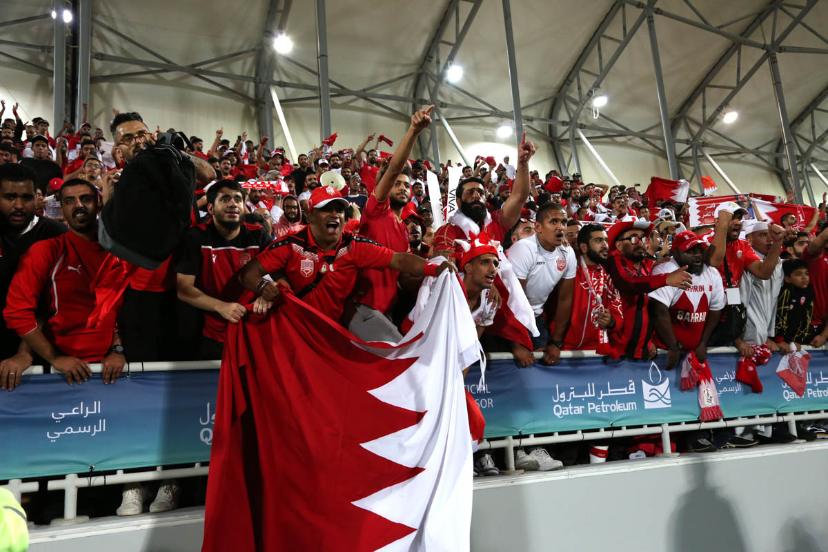 Bahraini fans dressed in their national red and white colours occupied six sections of the stadium. [Showkat Shafi/Al Jazeera]