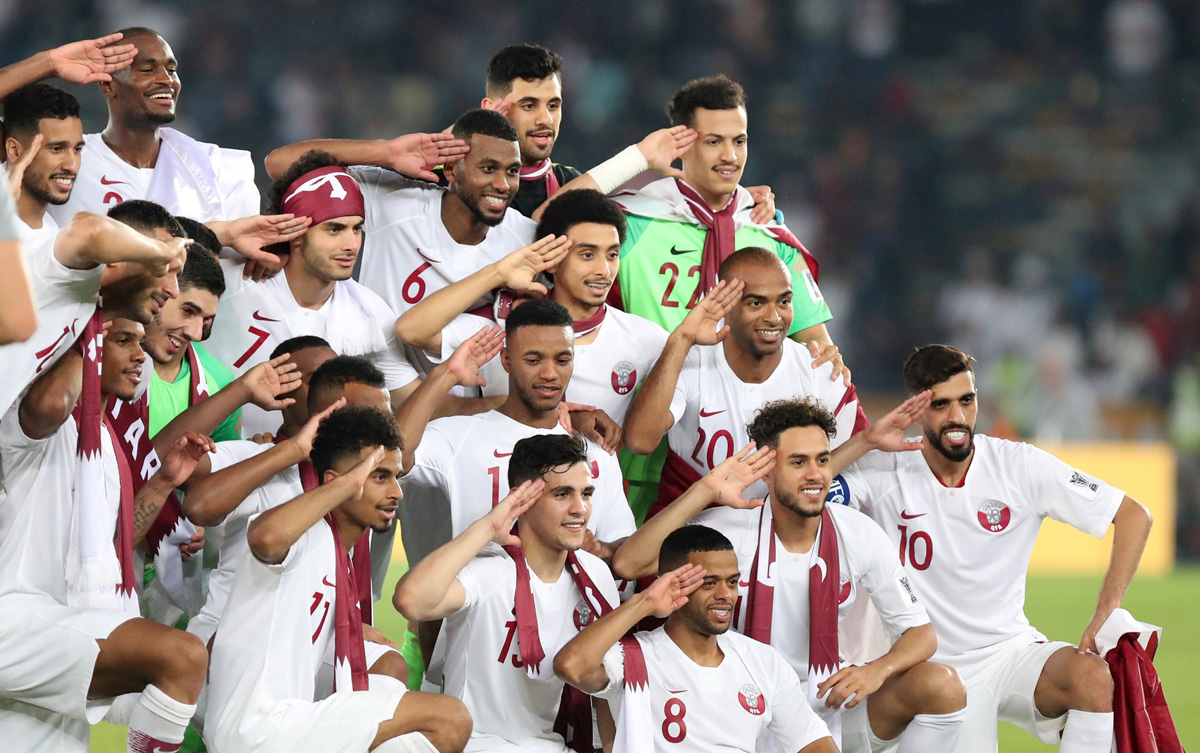 Qatar players celebrate winning the Asian Cup in Abu Dhabi. [Suhaib Salem/Reuters]