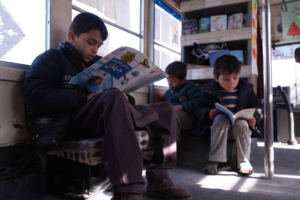 In the beginning, the community was a bit sceptical about sending their kids to the bus, but now the parents fully embrace and understand the value of the library, according to Freshta Karim. [Sorin Furcoi/Al Jazeera]