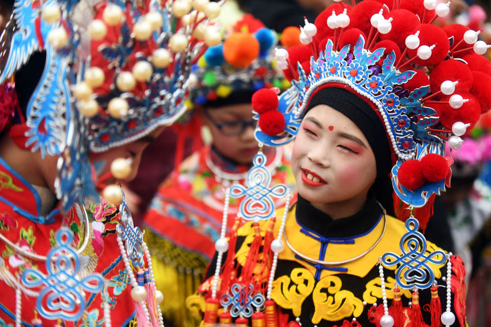 Children wearing costumes wait to perform during an event to celebrate the Chinese Lunar New Year, in Nanjing, Jiangsu province, China. [Reuters]