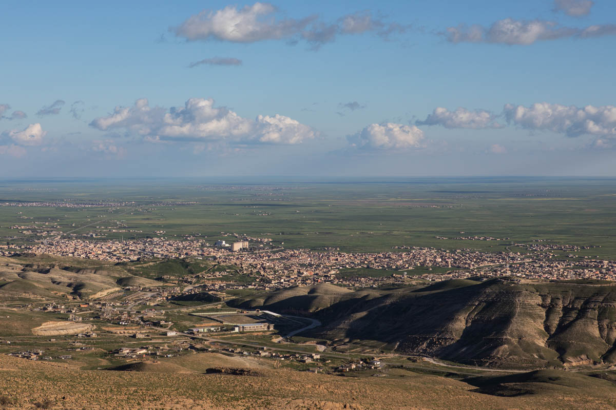 View of the valley with the city of Sinjar from Mount Sinjar. [Alessio Mamo/Al Jazeera]