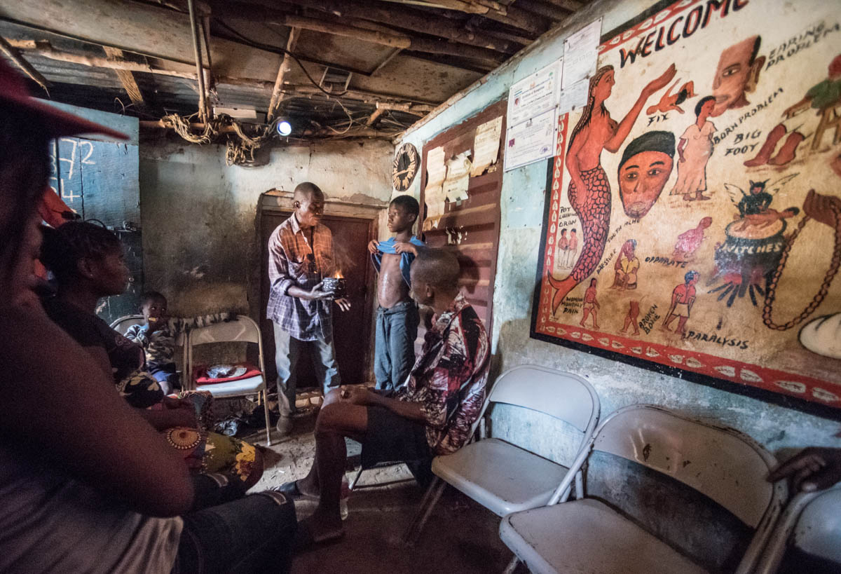 Inaccessible health services and spiritual beliefs drive those in need into the shrines of 45,000 traditional healers. Their role is ambivalent. In a country without comprehensive healthcare, they are the go-to people for everyday problems. [Olivia Acland/Al Jazeera]