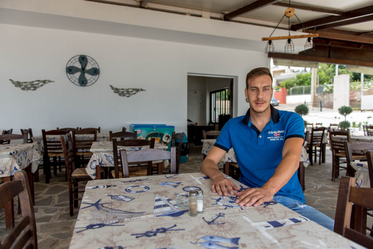 "The damage is very big and the financial assistance that was given was, in essence, insignificant," says Yiannis Stampelos, owner of a seaside restaurant in Mati. "Our business had to close during the high season and remained shut for 10 months – that was a huge blow, all the while the running expenses remained," he added. "This year, customer traffic is down 70 percent to 80 percent compared to the previous year. Many residents, nearly half of Mati, are not here either because their house was destroyed, or due to psychological reasons." [Dimitris Sideridis/Al Jazeera]