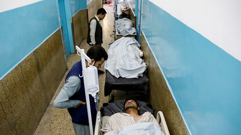 Injured men receive treatment in the hospital after sustaining wounds from a blast at a wedding hall in Kabul, Afghanistan August 18, 2019. REUTERS/Mohammad Ismail