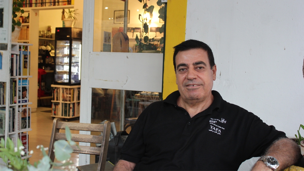 Michel al-Rahib, Palestinian citizens of Israel and owner of a coffee and bookshop in Jaffa says he doesn't see the point in voting but can't find an alternative. [Arwa Ibrahim/Al Jazeera]