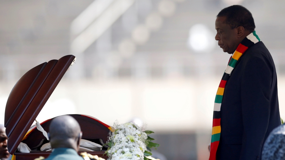 Zimbabwean President Emmerson Mnangagwa, pays his last respects during a state funeral of Zimbabwe's longtime ruler Robert Mugabe