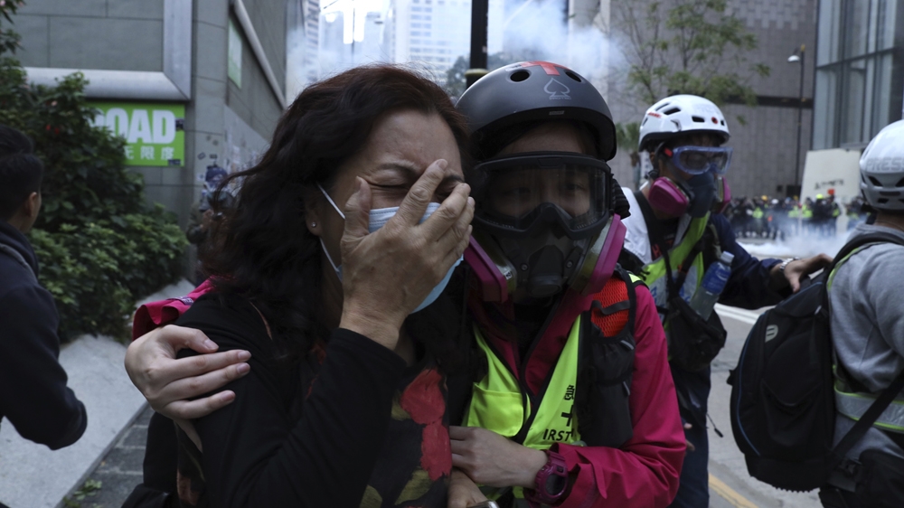 Clashes cut short Hong Kong rally as police officers are attacked