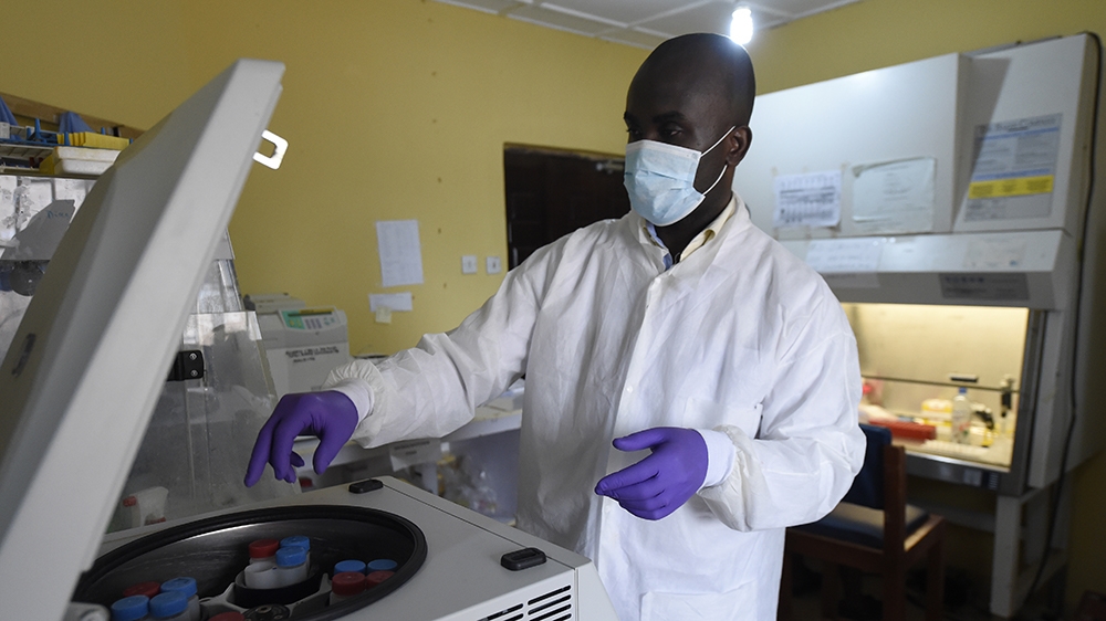 A health official works in the laboratory extraction room of the Institute of Lassa Fever Research and Control in Irrua Specialist Teaching Hospital in Irrua, Edo State, midwest Nigeria, on March 6, 2