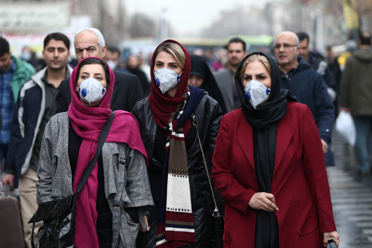 Iranian women walk at the Grand Bazaar in Tehran, Iran, after 15 people were reported dead from the coronavirus. [Nazanin Tabatabaee/WANA/Reuters]