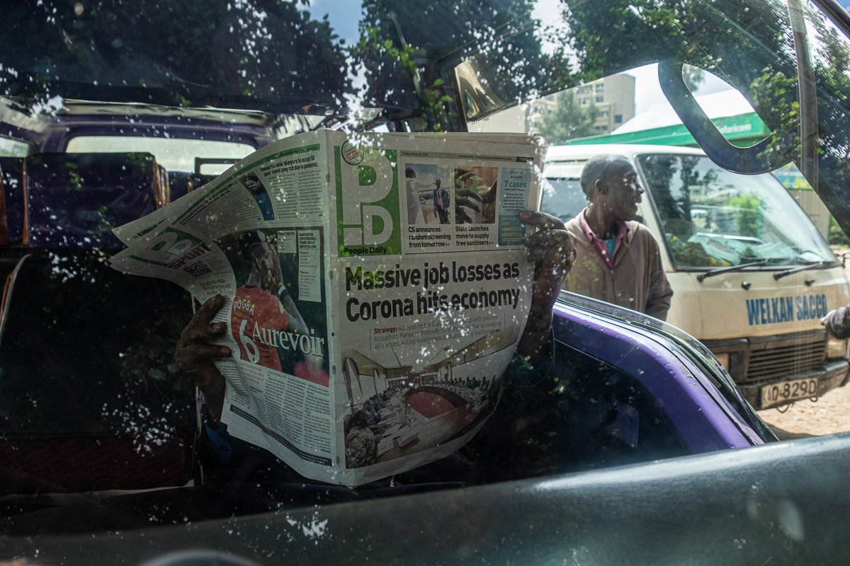 With news headlines like 'Massive job losses as corona hits economy', the outbreak has captured the attention of people in Kenya. [Joost Bastmeijer/Al Jazeera]