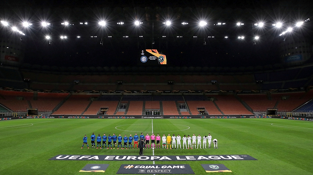 Soccer Football - Europa League - Round of 32 Second Leg - Inter Milan v Ludogorets - San Siro, Milan, Italy - February 27, 2020 The teams line up before the match in an empty stadium after fans we