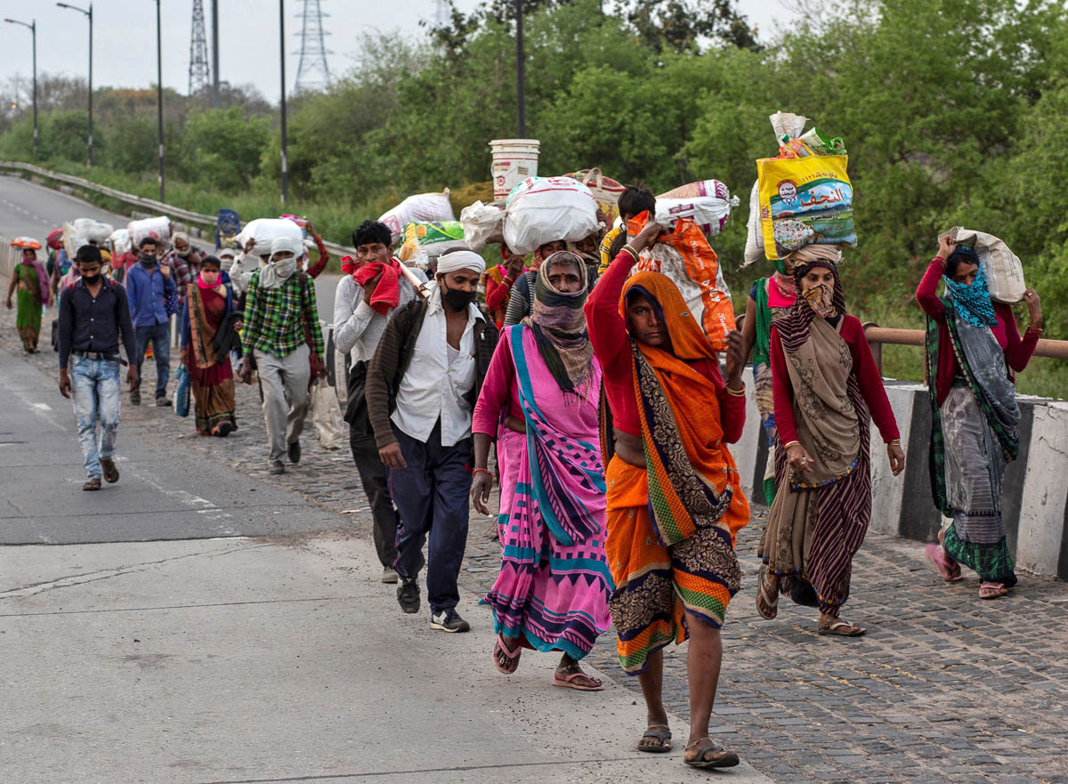 In Pictures: The long road home for India's migrant workers ...