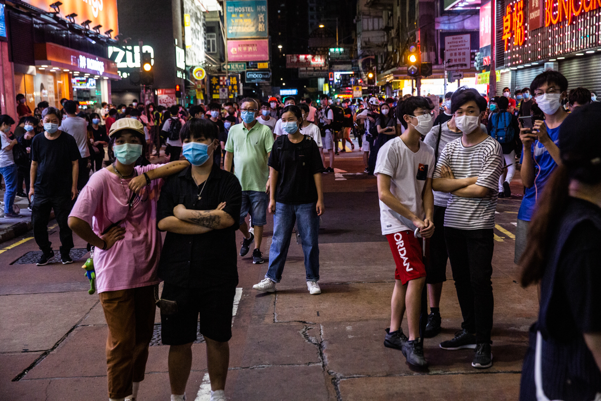 Pro-democracy demonstrators in Mong Kok district of Hong Kong. The self-governing Chinese territory was convulsed by seven straight months of often violent pro-democracy protests last year. [Isaac Lawrence/AFP]
