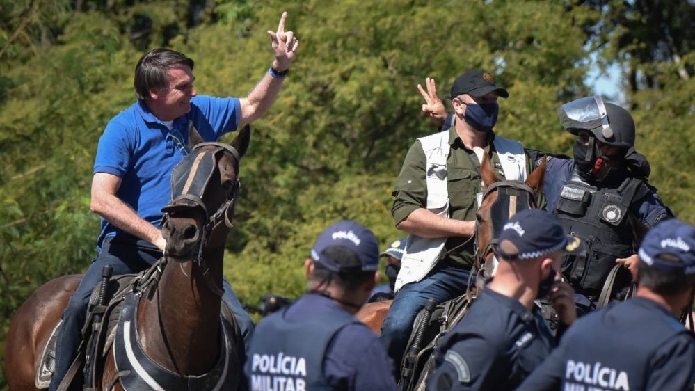 Bolsonaro saddles up to join rally against Brazil's top court - Al Jazeera English