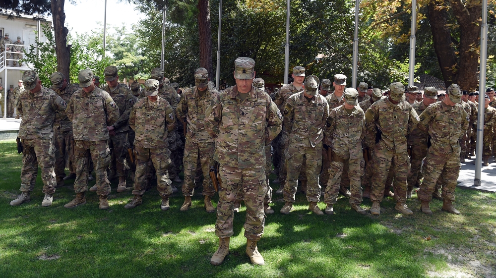 US military personnel attend a memorial ceremony in honour of the 15th anniversary of the September 11, 2001 attacks on New York and Washington DC, at the International Security Assistance Force (ISAF