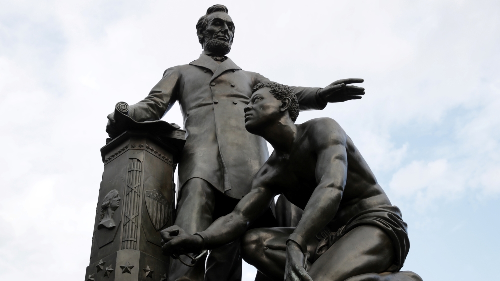 The Emancipation Memorial, depicting Lincoln standing over a freed slave, stands in Lincoln Park in Washington
