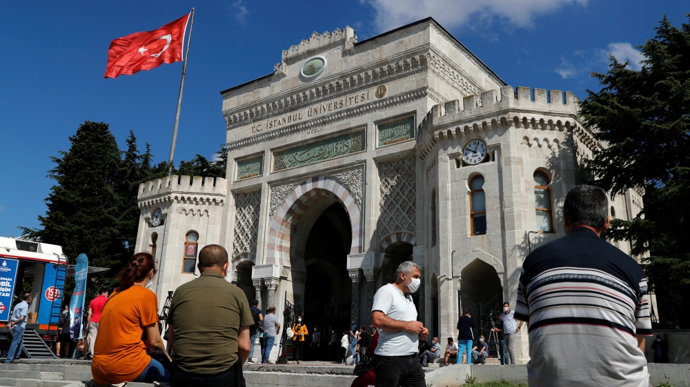 Parents wait outside the main campus of the Istanbul University during the national university entrance exams
