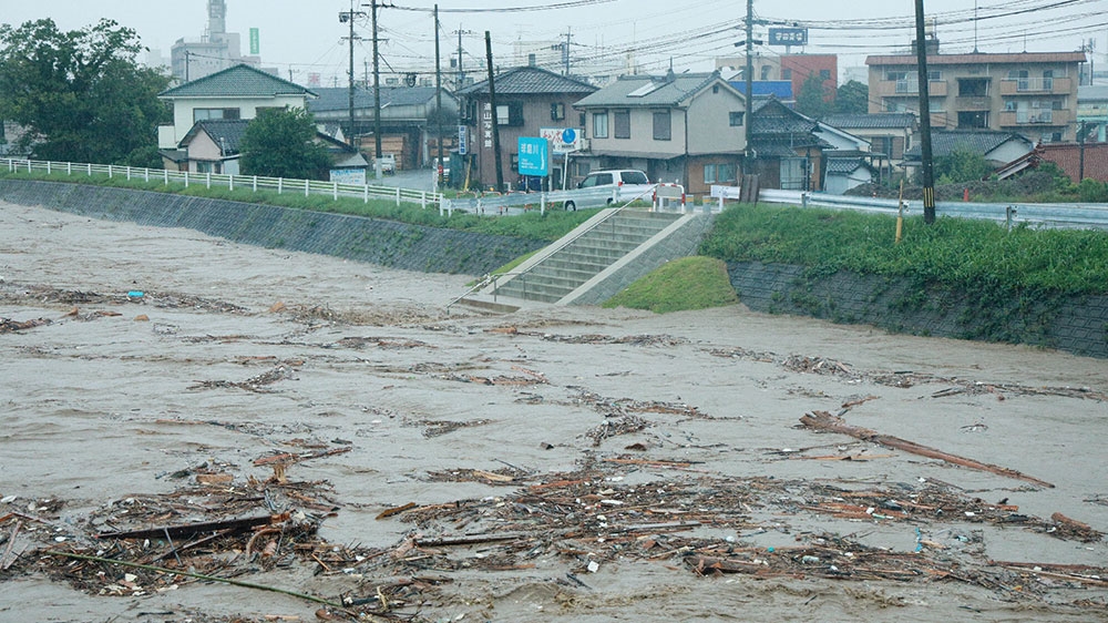 Heavy rains flood Japan, over a dozen presumed dead
