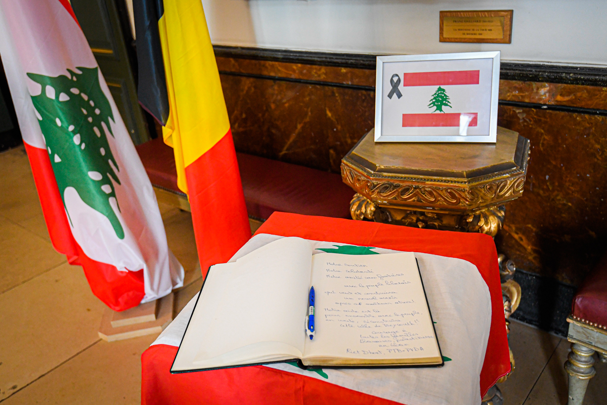 A book of condolences for victims of the explosion in Beirut, at Brussels city hall. [Laurie Dieffembacq/Belga/AFP]