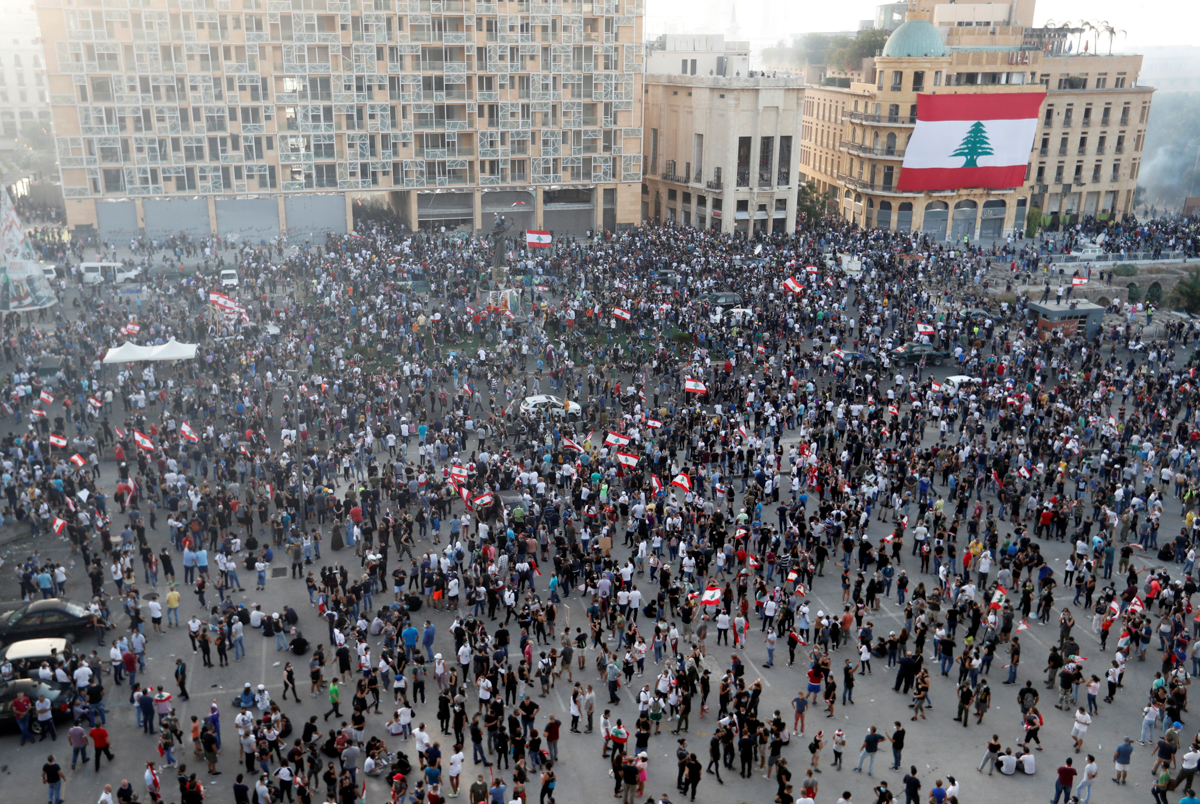 Thousands gathered in central Beirut on Saturday to vent their anger at a political elite they blame for the deadly explosion. [Thaier Al-Sudani/Reuters]