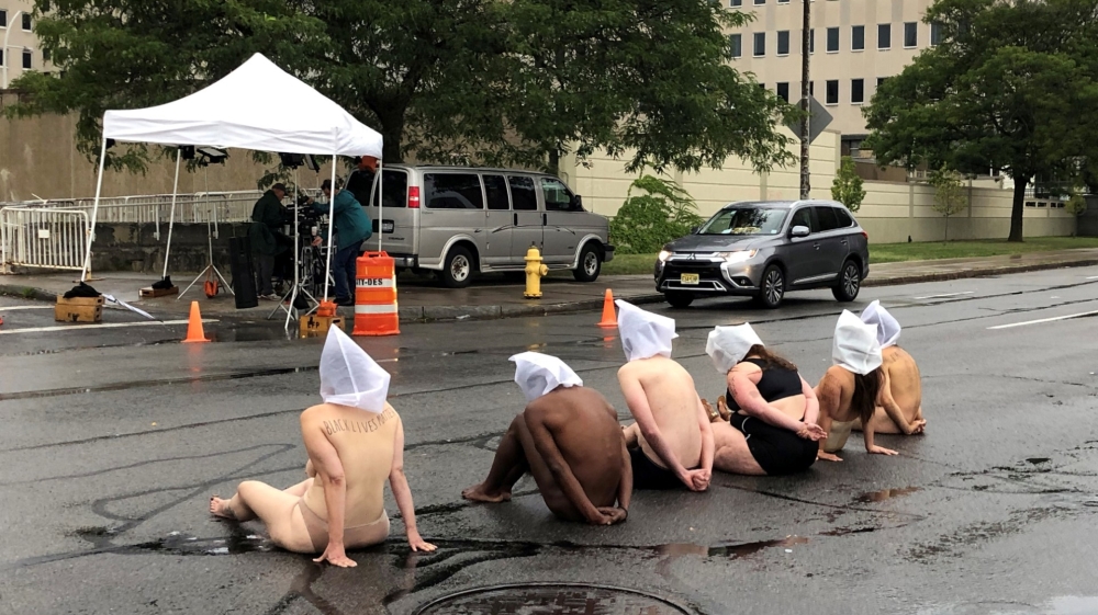 Naked protesters stage a demonstration to protest the death of Daniel Prude 