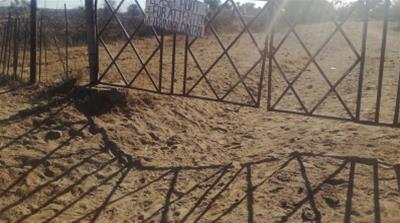 Gate at the former tobacco farmer, Shandu Gumede’s farm in Nyamandlovu, Umguza District, in Matabeleland North Province, Zimbabwe that she is now reportedly leasing to a cattle farmer