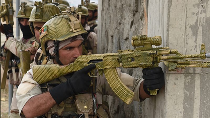 Afghan Crisis Response Unit personnel take up positions during a training exercise in Kabul [AFP]