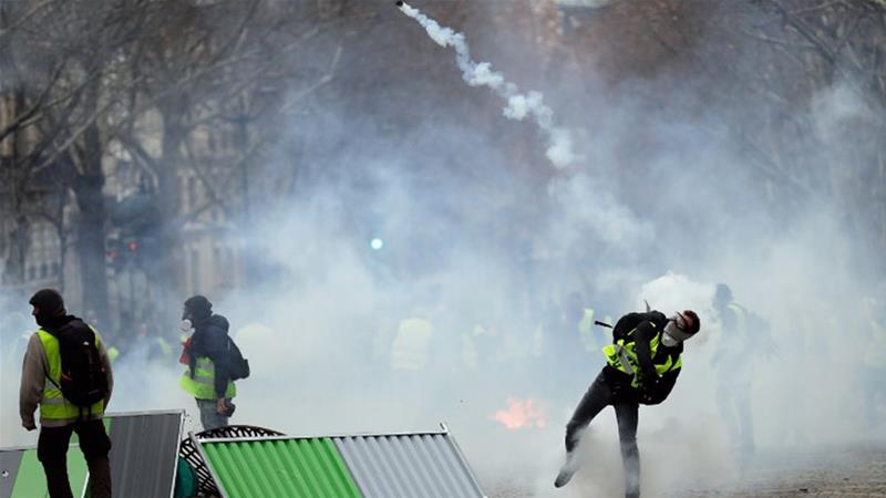 French police fire tear gas at protesters in central Paris