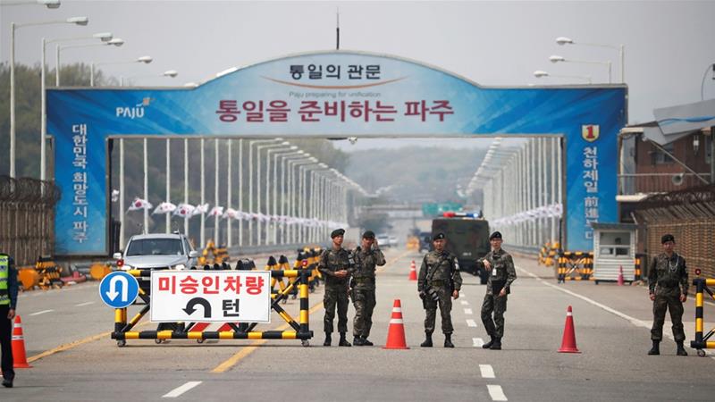 Kim Jong Un will cross into South Korea for the first time on Friday [Kim Hong-ji/Reuters]