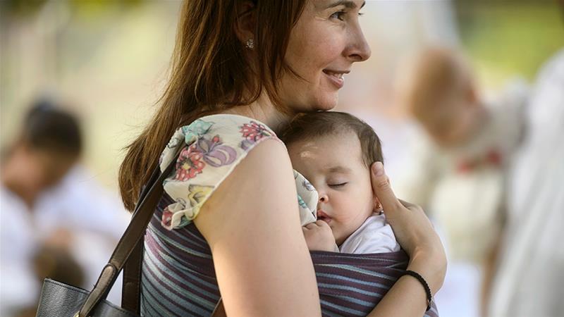 Over the past 40 years, the World Health Organization has consistently urged mothers to breastfeed their children [File: Andreea Alexandru/AP Photo]