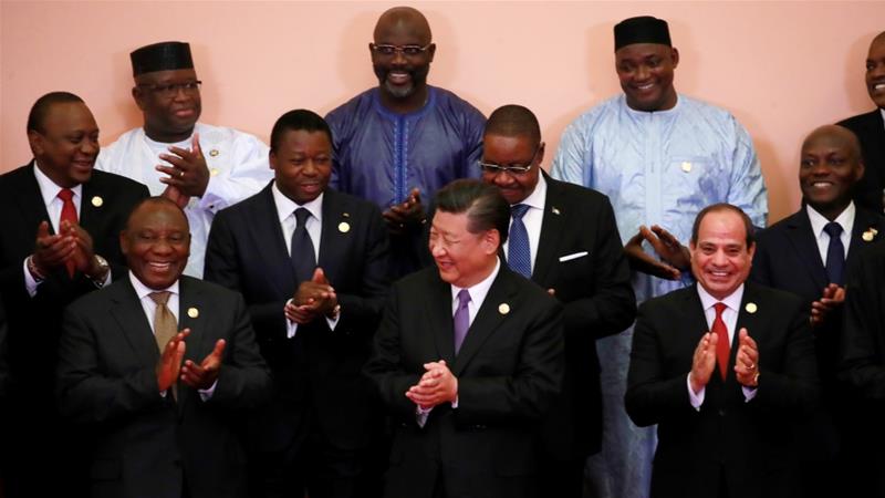Chinese President Xi Jinping and African leaders clap during a group photo session during the FOCAC Summit in Beijing, China, September 3, 2018 [File: How Hwee Young/Reuters]