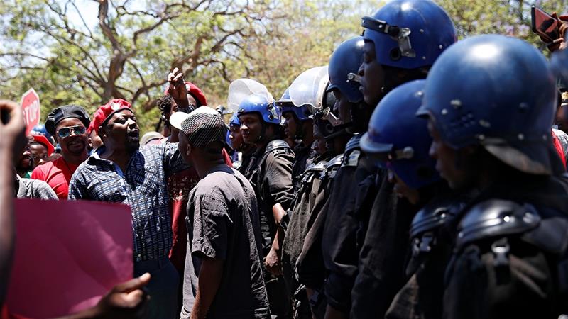 Anti-riot police blocked public sector workers from marching to government offices on November 6 with a petition demanding better pay in Harare. Despite hyperinflation, wages in Zimbabwe have remained stagnant [File: Philimon Bulawayo/Reuters]