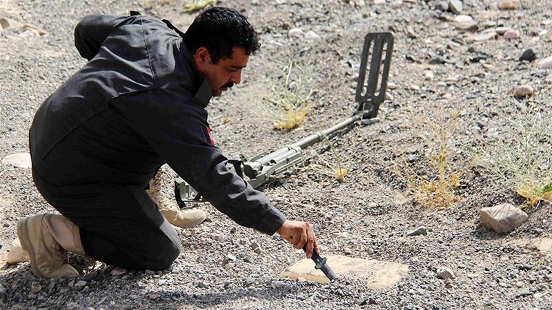 Sirajuddin Afghanmal, an Afghan Police official, removes landmines planted in Kandahar, Afghanistan. He has so far removed around 10,000 mines in a 12-year career [File: 2017/Muhammad Sadiq/EPA]