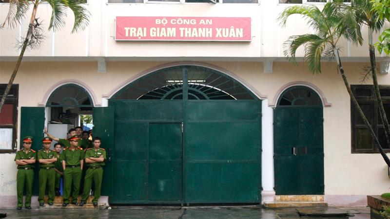 Police officers outside the Thanh Xuan prison in the Vietnamese capital, Hanoi [File: Kham/Reuters]