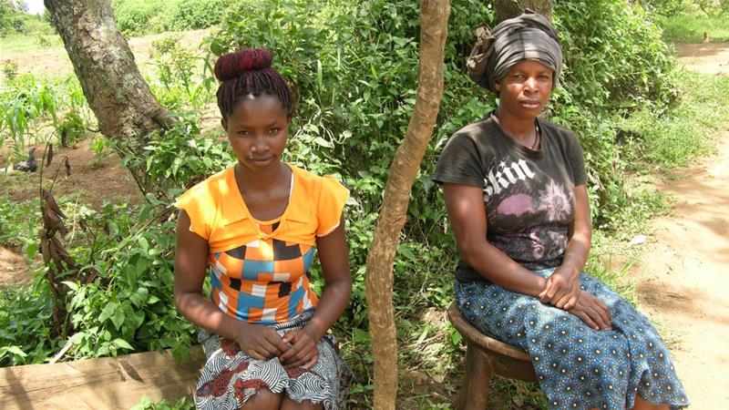 Grace Boke, left, and her partner Pauline Gati at their home in Kibunto village, Kuria District [Mary Mwendwa/Al Jazeera]