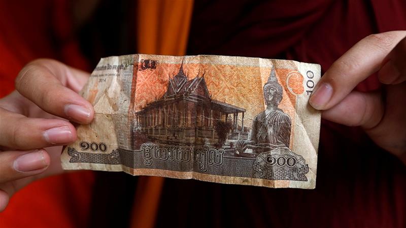 In the 1990s, microfinance offered a path out of poverty for Cambodians after decades of war. But according to a new report, lending in the country has led to punishing debt [Samrang Pring/Reuters]